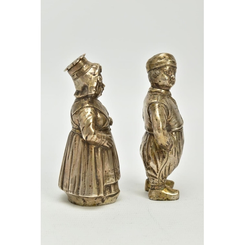 189 - A PAIR OF EARLY 20TH CENTURY CONTINENTAL WHITEL METAL NOVELTY PEPPERETTES, in the form of a Dutch ma... 