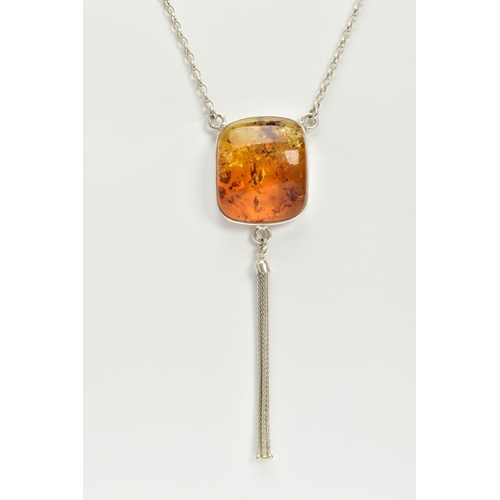 33 - A CASED WHITE METAL AMBER PENDANT NECKLACE, the fitted pendant of square form, set with a square cab... 