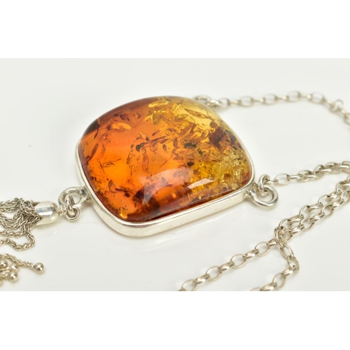 33 - A CASED WHITE METAL AMBER PENDANT NECKLACE, the fitted pendant of square form, set with a square cab... 