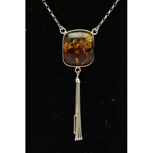 33 - A CASED WHITE METAL AMBER PENDANT NECKLACE, the fitted pendant of square form, set with a square cab... 