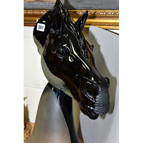 381 - A CONTEMPORARY MURANO GLASS SCULPTURE OF A HORSE'S HEAD (TESTE CAVALLIER), the upper half black, the... 