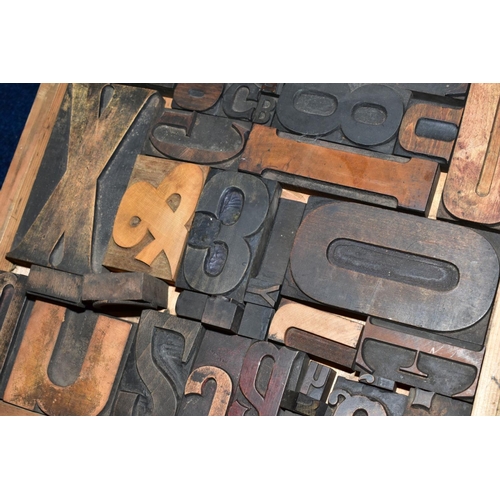 402 - A WOODEN FRAME CONTAINING AN ASSORTMENT OF PRINTING BLOCK LETTERS, NUMBERS AND PUNCTUATION, etc, fra... 