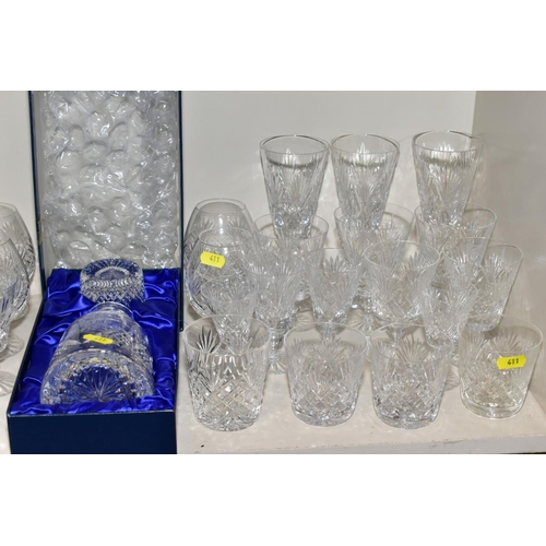 411 - A QUANTITY OF GLASSWARE, including three square decanters, a conical shaped vase, a water jug, a lar... 