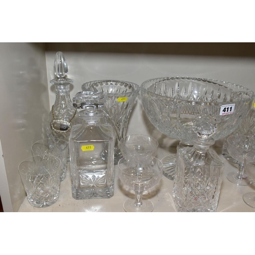 411 - A QUANTITY OF GLASSWARE, including three square decanters, a conical shaped vase, a water jug, a lar... 