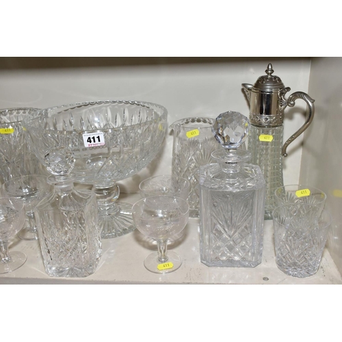 411 - A QUANTITY OF GLASSWARE, including three square decanters, a conical shaped vase, a water jug, a lar... 