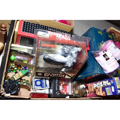 412 - TWO BOXES OF BOARD GAMES, PUZZLES, SOFT TOYS, DOLL'S FURNITURE, etc, including wooden puzzles, two T... 