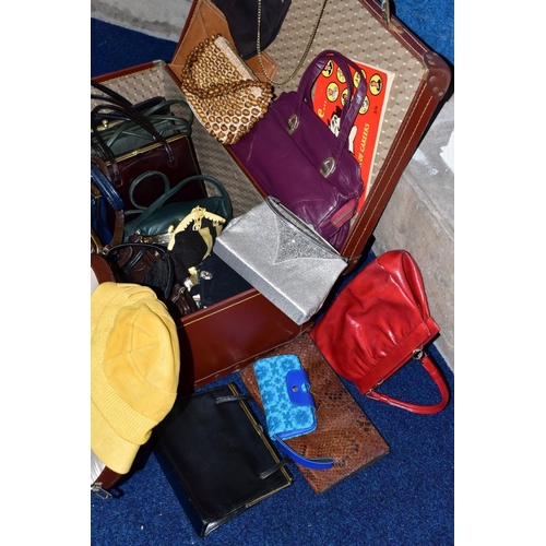 435 - TWO SUITCASES AND TWO VANITY CASES CONTAINING HANDBAGS, PURSES ETC (one suitcase empty)