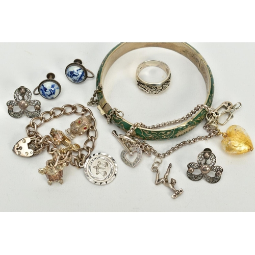 44 - A SELECTION OF JEWELLERY, to include a silver charm bracelet, suspending four white metal charms suc... 