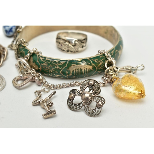 44 - A SELECTION OF JEWELLERY, to include a silver charm bracelet, suspending four white metal charms suc... 