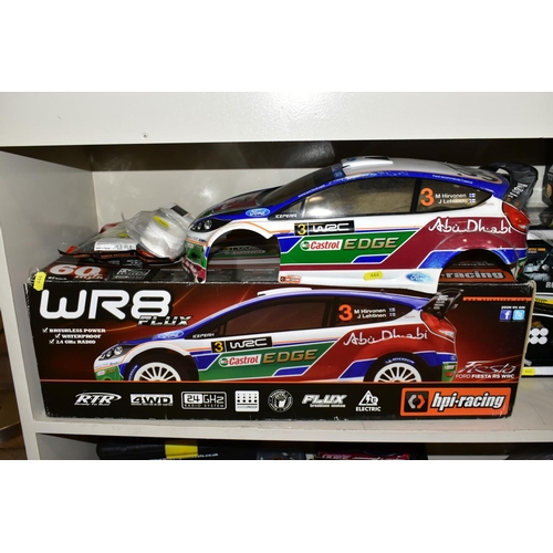 444 - THREE BOXED REMOTE CONTROL VEHICLES, comprising an hpi: racing WR8 Flux Ford Fiesta RS WRC, with som... 