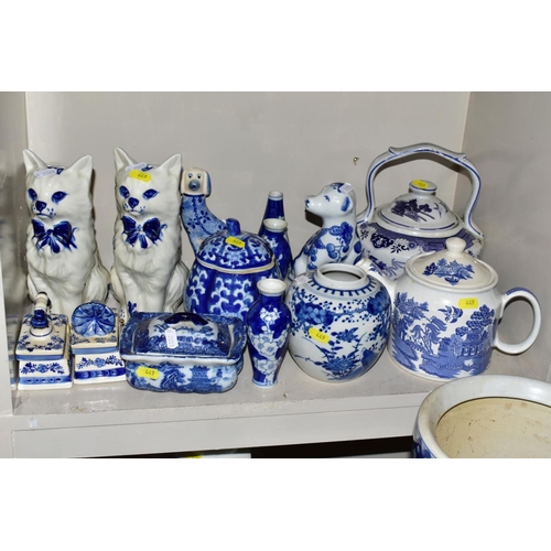 449 - A QUANTITY OF MODERN BLUE AND WHITE CERAMICS, including Oriental vases, stick stand, jars and covers... 