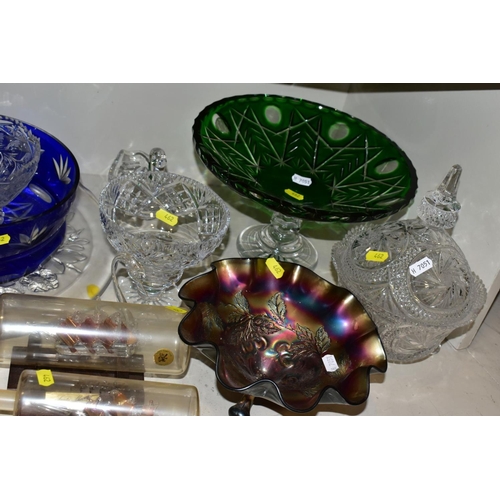 462 - A QUANTITY OF GLASSWARE, to include four decanters, a pair of candle holders with glass shades, jars... 