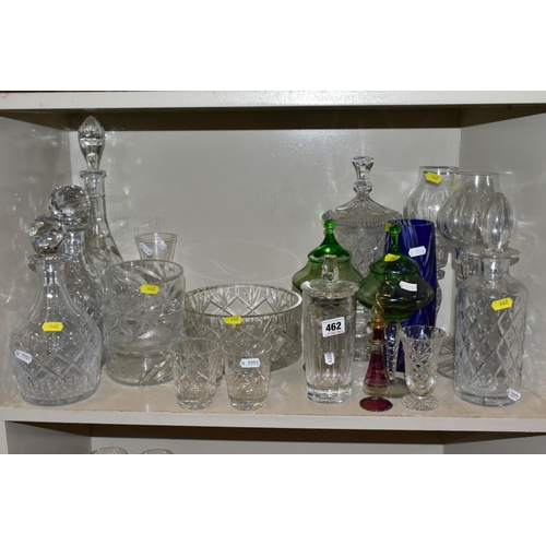 462 - A QUANTITY OF GLASSWARE, to include four decanters, a pair of candle holders with glass shades, jars... 