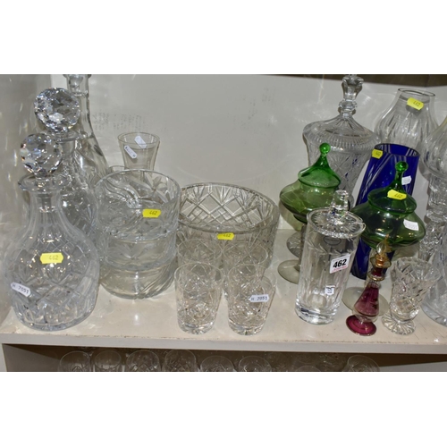 462 - A QUANTITY OF GLASSWARE, to include four decanters, a pair of candle holders with glass shades, jars... 