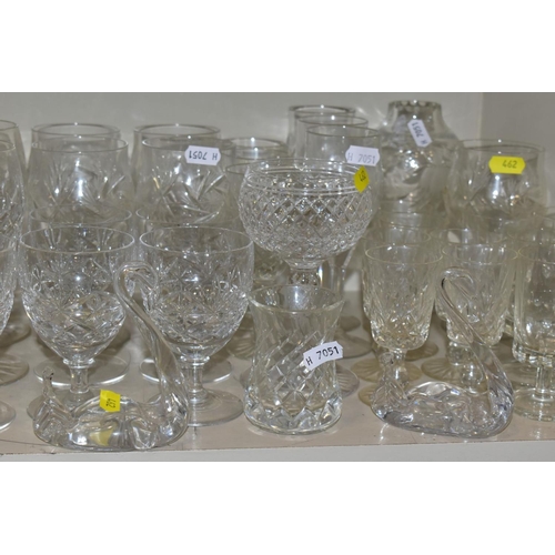 462 - A QUANTITY OF GLASSWARE, to include four decanters, a pair of candle holders with glass shades, jars... 