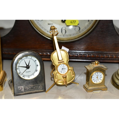 477 - AN OAK CASED CHIMING MANTEL CLOCK, chimes but only runs for a few seconds, together with a quartz ca... 