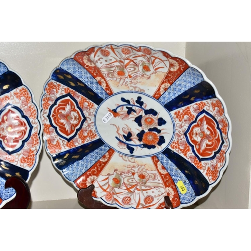 480 - A PAIR OF JAPANESE IMARI PATTERN OVAL SHAPED PLATES, with scalloped edges, decorated with Chrysanthe... 