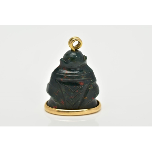 5 - AN 18CT GOLD MOUNTED CARVED BLOODSTONE PENDANT, the carved bloodstone in the form of a buddha, mount... 