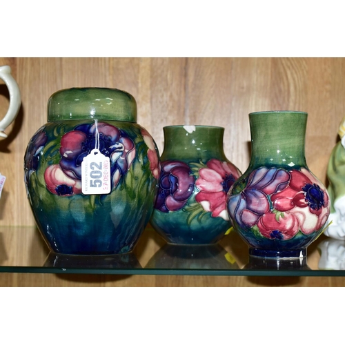 502 - THREE PIECES OF MOORCROFT POTTERY, all 'Anemone' pattern on a green ground, comprising ginger jar, h... 