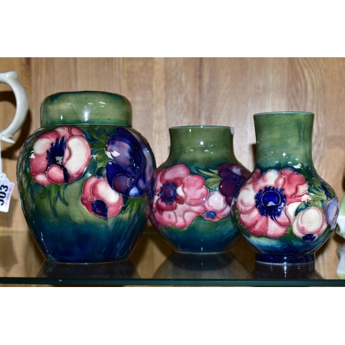 502 - THREE PIECES OF MOORCROFT POTTERY, all 'Anemone' pattern on a green ground, comprising ginger jar, h... 