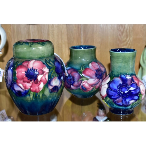 502 - THREE PIECES OF MOORCROFT POTTERY, all 'Anemone' pattern on a green ground, comprising ginger jar, h... 