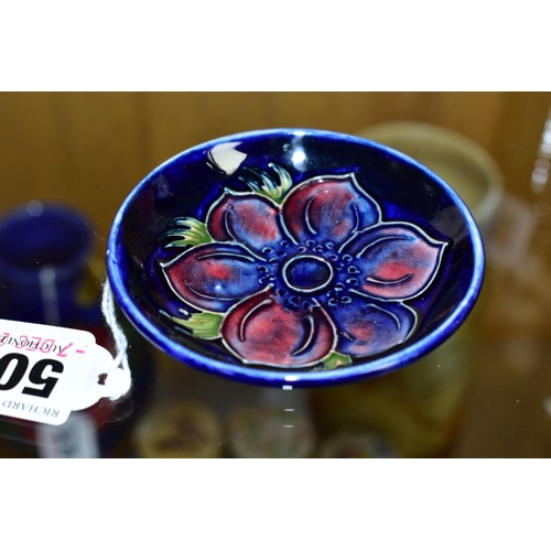 509 - A MOORCROFT POTTERY PIN DISH, 'Anemone' pattern on blue ground, impressed backstamp, diameter approx... 