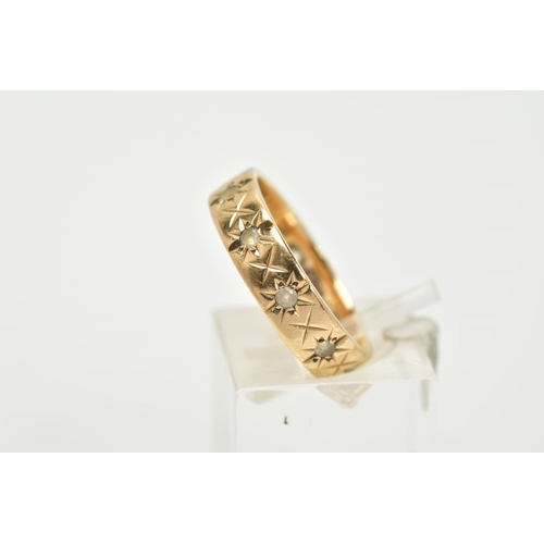 52 - A 9CT GOLD FULL ETERNITY RING, the band with an engraved star detail, set with circular cut colourle... 