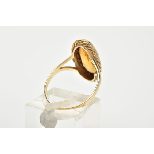 53 - A 9CT GOLD CITRINE RING, designed with an oval cut citrine, within a collet mount and rope twist sur... 