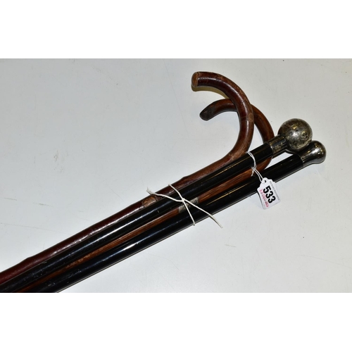 533 - TWO SILVER TOPPED WALKING CANES, (one with dent), length 90cm, together with two walking sticks, one... 