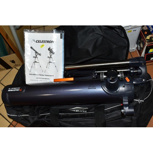 543 - A CELESTRON ASTROMASTER 76 TELESCOPE, with stand, manual and canvas bag