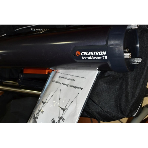 543 - A CELESTRON ASTROMASTER 76 TELESCOPE, with stand, manual and canvas bag