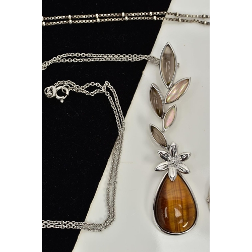 55 - TWO SILVER PENDANT NECKLACES, the first designed with a tiger eye and mother of pearl floral drop pe... 