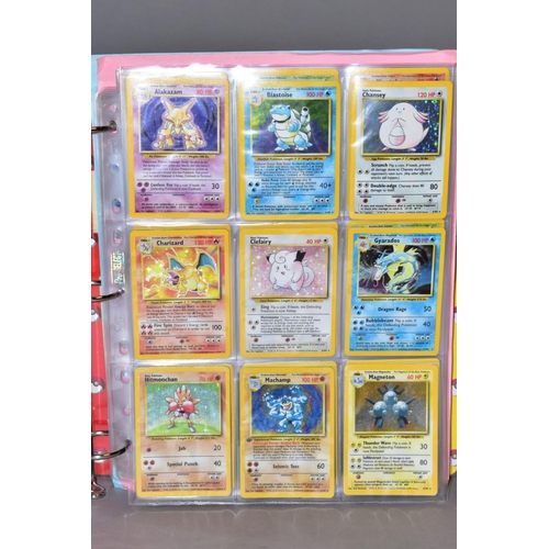 551 - A COMPLETE SET OF POKEMON BASE SET CARDS, and a complete set of Base set 2 cards except that Chariza... 