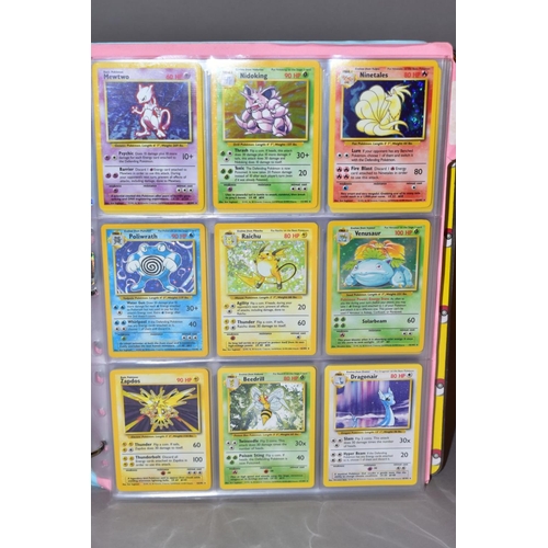 551 - A COMPLETE SET OF POKEMON BASE SET CARDS, and a complete set of Base set 2 cards except that Chariza... 