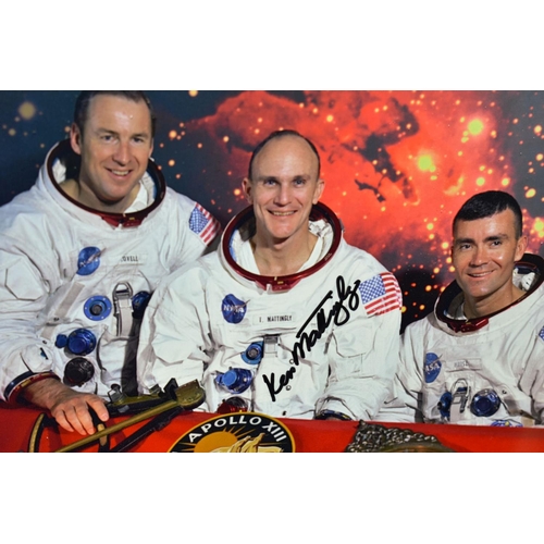 564 - NASA SPACE EXPLORATION INTEREST, a photograph of the crew of Apollo 13, signed by Captain Jim Lovell... 