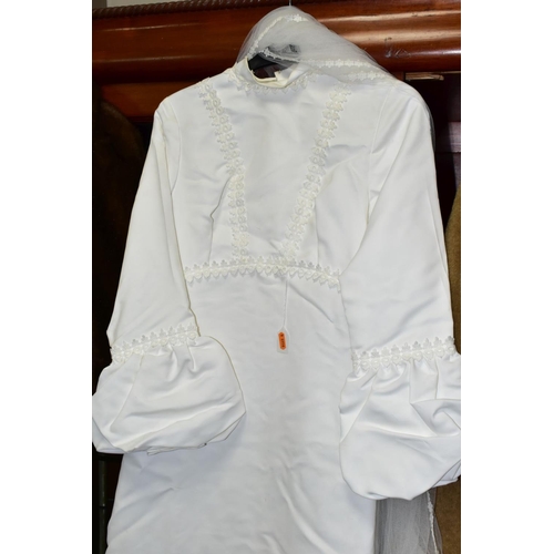 597 - A CIRCA 1970'S WEDDING DRESS, WITH VEIL AND HAIR BAND, approximate dress size 14, together with a si... 