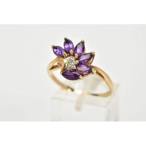 62 - A 9CT GOLD AMETHYST AND DIAMOND RING, of a spray design set with six marquise cut amethyst stones, w... 