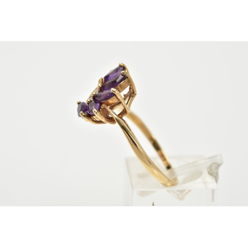 62 - A 9CT GOLD AMETHYST AND DIAMOND RING, of a spray design set with six marquise cut amethyst stones, w... 