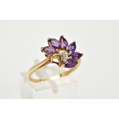 62 - A 9CT GOLD AMETHYST AND DIAMOND RING, of a spray design set with six marquise cut amethyst stones, w... 