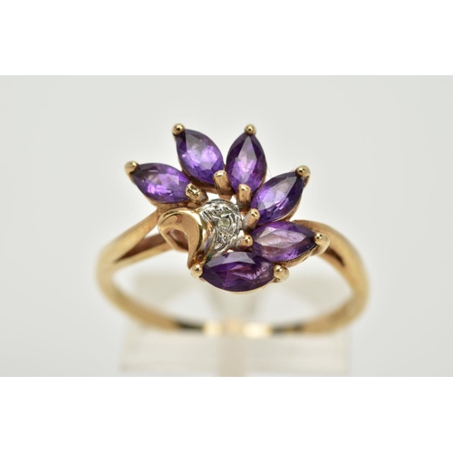 62 - A 9CT GOLD AMETHYST AND DIAMOND RING, of a spray design set with six marquise cut amethyst stones, w... 