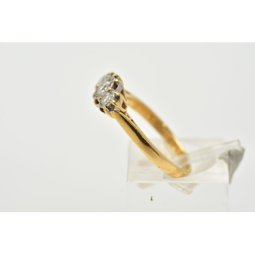 69 - AN 18CT GOLD THREE STONE DIAMOND RING, designed with three star set, graduated round brilliant cut d... 