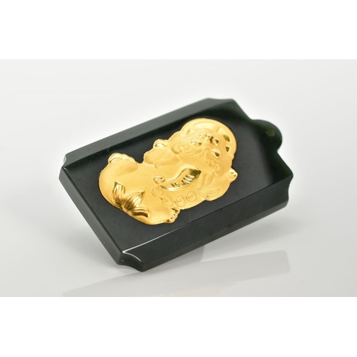 79 - A NEPHRITE PENDANT, of a carved rectangular form, inlayed with a gold tone oriental figure, with an ... 