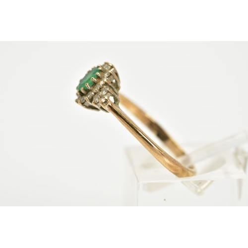 87 - A 9CT GOLD EMERALD AND DIAMOND CLUSTER RING, designed with a central oval cut emerald, within a roun... 