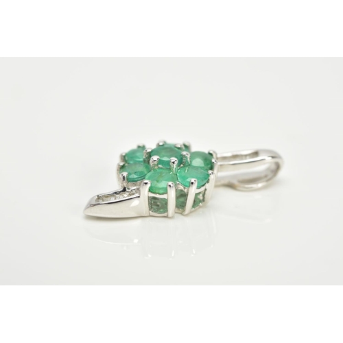 89 - A 9CT WHITE GOLD EMERALD AND DIAMOND PENDANT, in the form of a flower, set with a central circular c... 