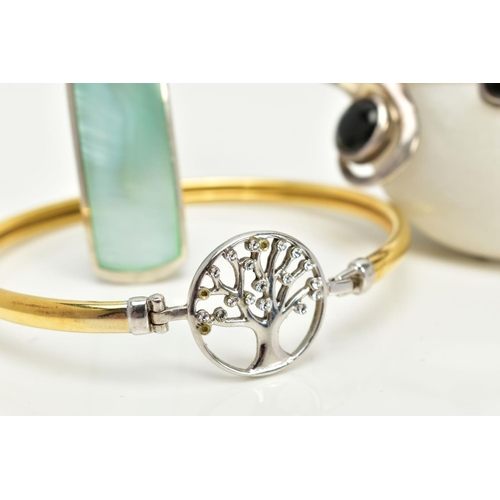 98 - A BANGLE AND TWO PENDANTS, the yellow bangle, designed with an openwork tree clasp, set with cubic z... 