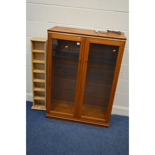 1290 - A 1970'S/80'S TEAK GLAZED TWO DOOR BOOKCASE, with four glass shelves, width 90cm x depth 39cm x heig... 