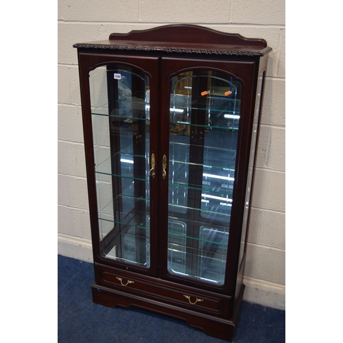 1294 - A MAHOGANY DOUBLE DOOR BOOKCASE, with three fixed glass shelves above a single drawer, width 83cm x ... 