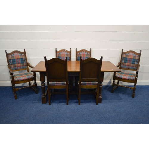 1260 - AN OLD CHARM OAK REFECTORY DINING TABLE, with a carved frieze, on turned legs united by a H stretche... 