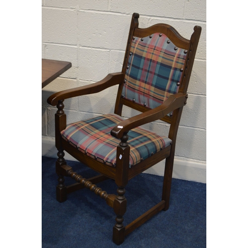 1260 - AN OLD CHARM OAK REFECTORY DINING TABLE, with a carved frieze, on turned legs united by a H stretche... 