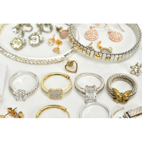 106 - A SELECTION OF JEWELLERY, to include two white metal bangles, a white metal cross pendant set with s... 